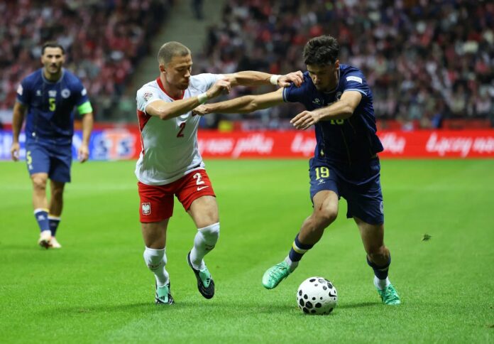 Nikola Zlomislić brani udarac na utakmici Poljska - BiH